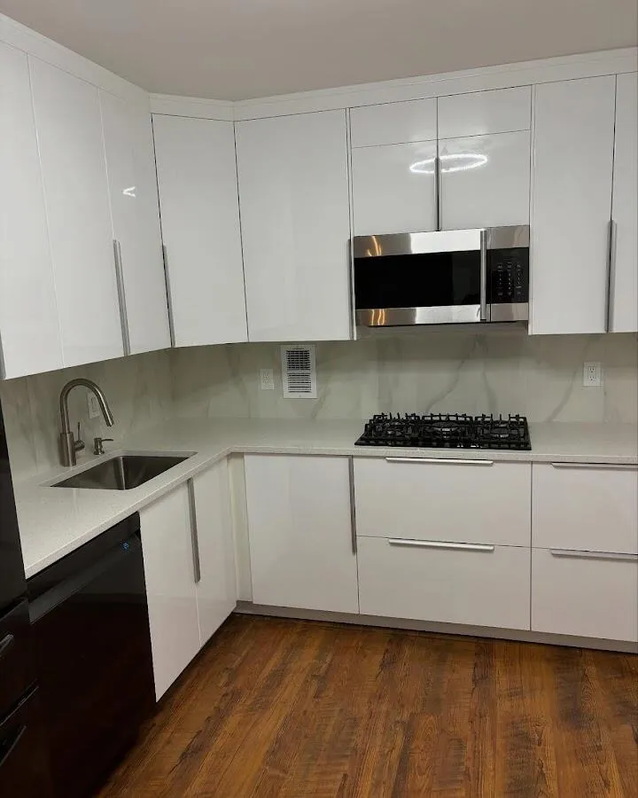 Restored kitchen with white cabinets after water damage in Belle Isle